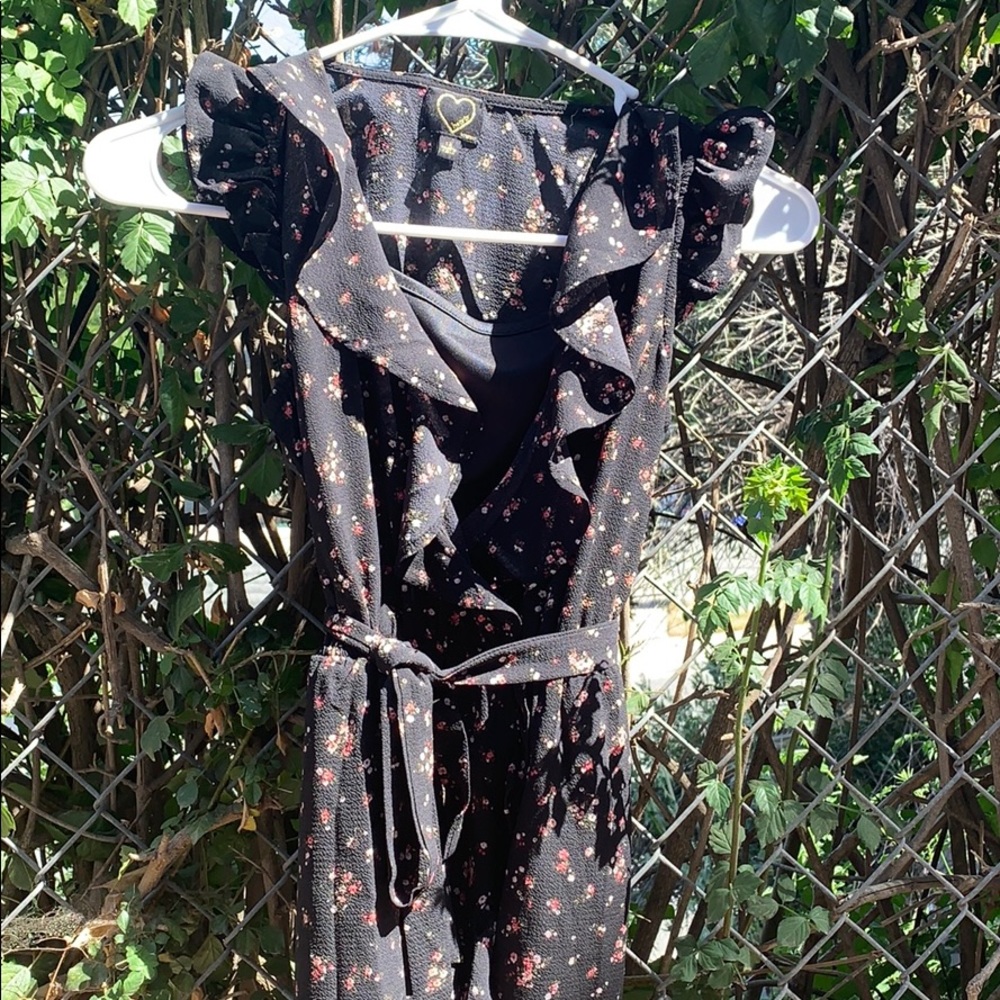 a black dress with pink and white flowers